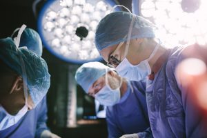 Team performs surgery under bright lights