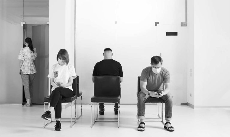 black and white of people in a hospital waiting room